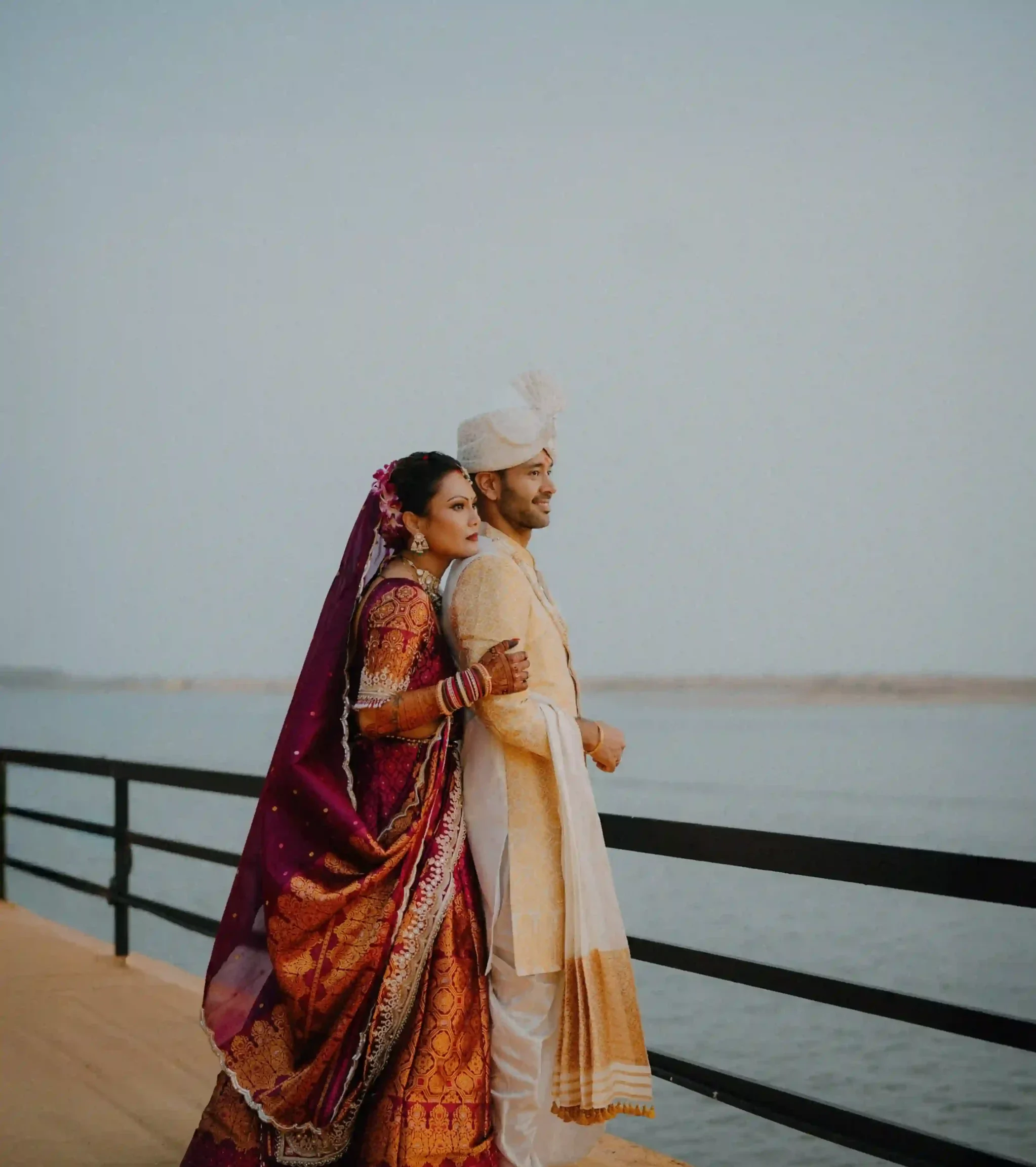 Rahul and Diya posing against the backwater views at Isola Di Cocco, Poovar