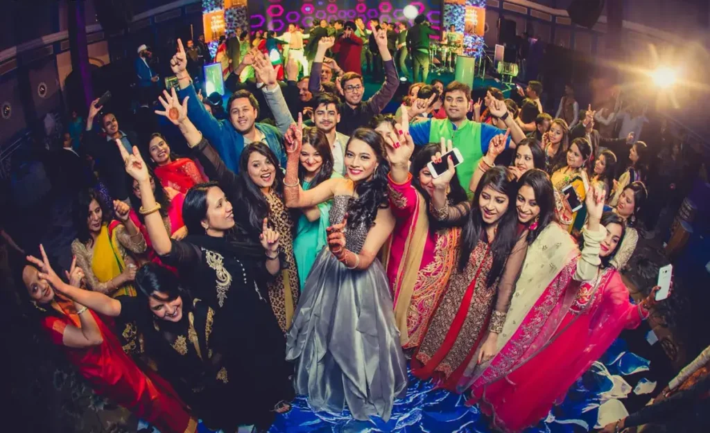 Friends and family enjoying a group dance at a post-wedding party in Kerala, coordinated by Melodia Event Management