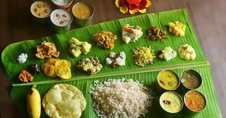 Traditional Kerala sadya feast served on a fresh banana leaf, arranged by catering services and kerala wedding planners Melodia Event Management