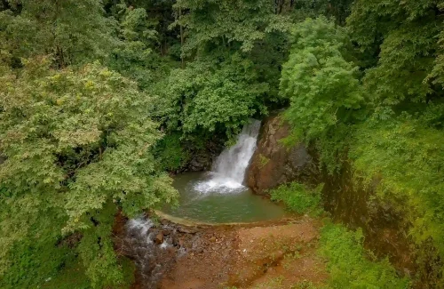 Romantic wedding shoot location with waterfall at Ambient Xperience Kerala