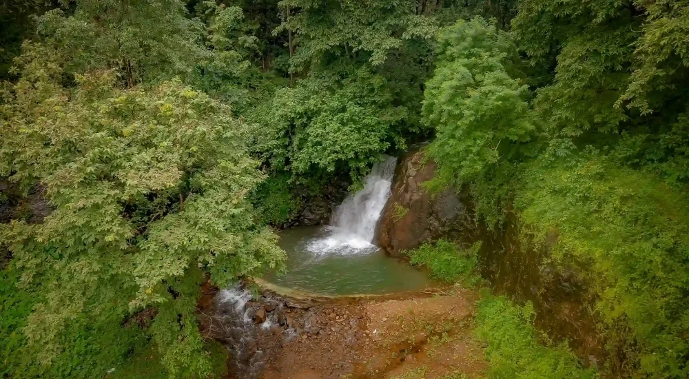 Romantic wedding shoot location with waterfall at Ambient Xperience Kerala