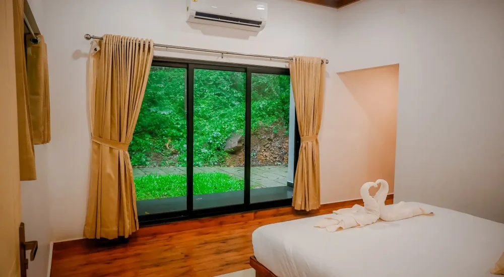 Well-furnished room at Ambient Xperience Kerala ideal for wedding guests and family stay