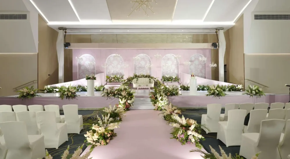 Elegant floral wedding stage decor at Chakolas Pavilion Convention Centre Thrissur