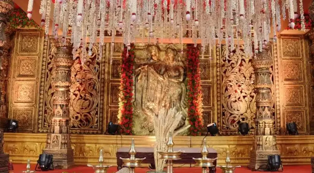 Traditional Hindu Wedding Stage Decor by Melodia Event Management at Poonthanam Auditorium