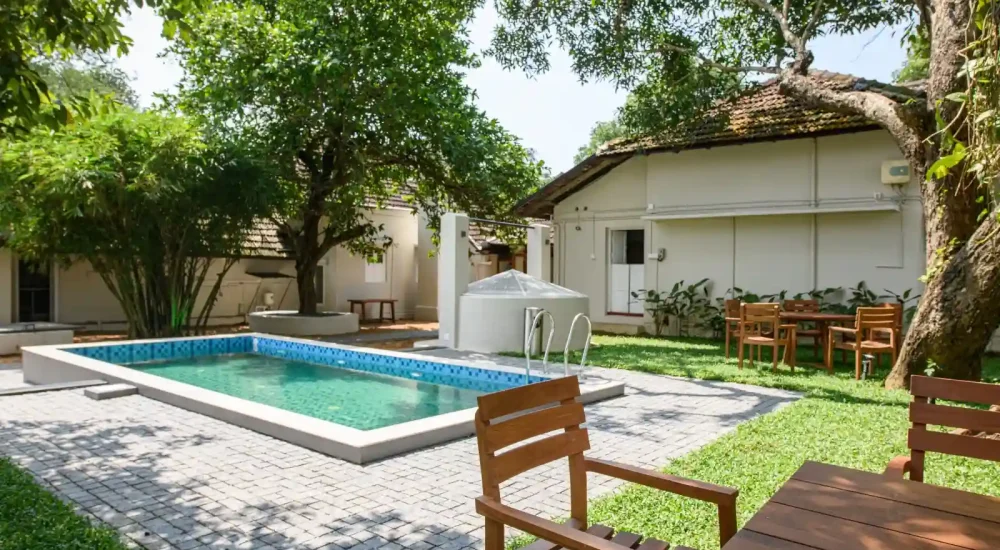 Ammachi Veedu heritage wedding venue in Kanjikuzhi Kottayam featuring traditional Kerala architecture and outdoor lawn space.