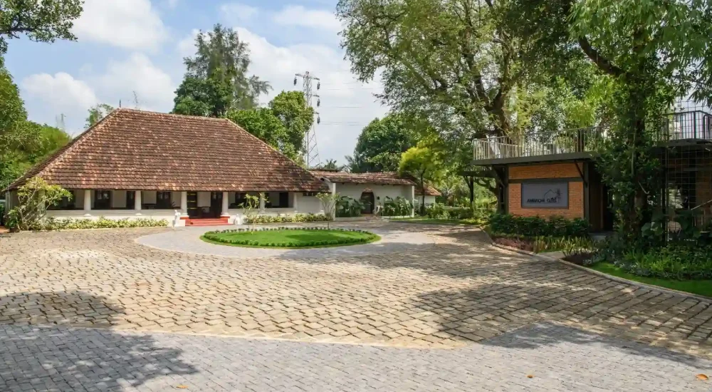 Ammachi Veedu heritage wedding venue in Kanjikuzhi Kottayam showing external garden area and surrounding lush greenery.