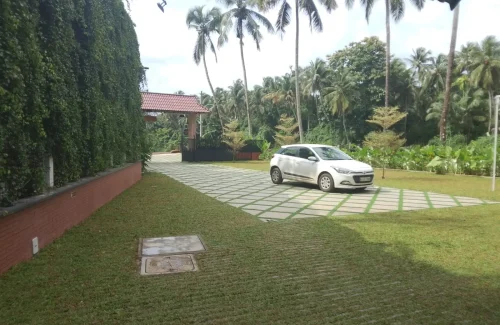 Arcadia Resort & Banquet ,Paved car parking area and entrance lane at Arcadia Resort.