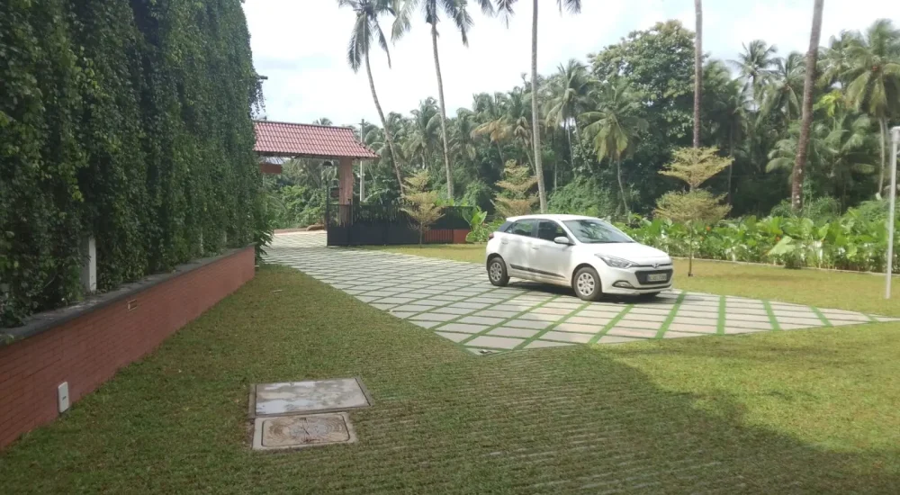 Arcadia Resort & Banquet ,Paved car parking area and entrance lane at Arcadia Resort.