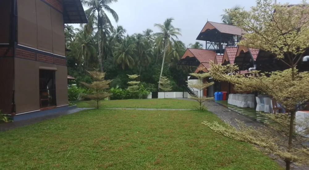 Arcadia Resort & Banquet ,Paved entrance courtyard and main villa at Arcadia Resort Guruvayoor.