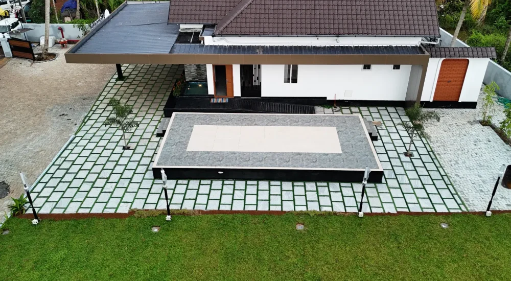 Aerial view of the $10\text{m} \times 5\text{m}$ built-in outdoor stage and main building at Coconut Groves venue