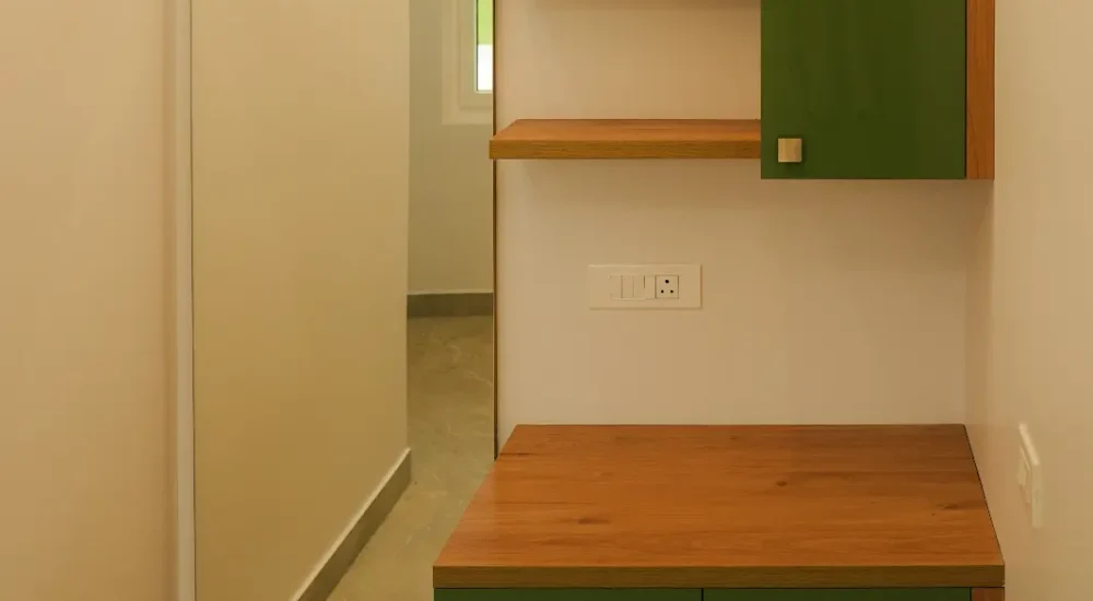Air-conditioned bridal dressing room with mirror and wooden storage cabinets at Coconut Groves Convention Centre.