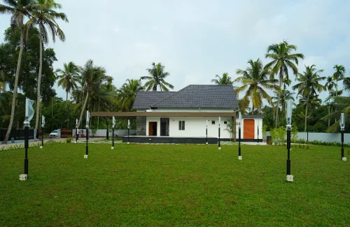 Outdoor wedding lawn and main hall with built-in stage at Coconut Groves Convention Centre Kanjiramattom.