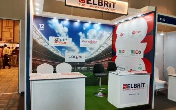 Professional corporate events setup by Melodia Event Management in Thrissur, including stage backdrop, display banners, and branded counters