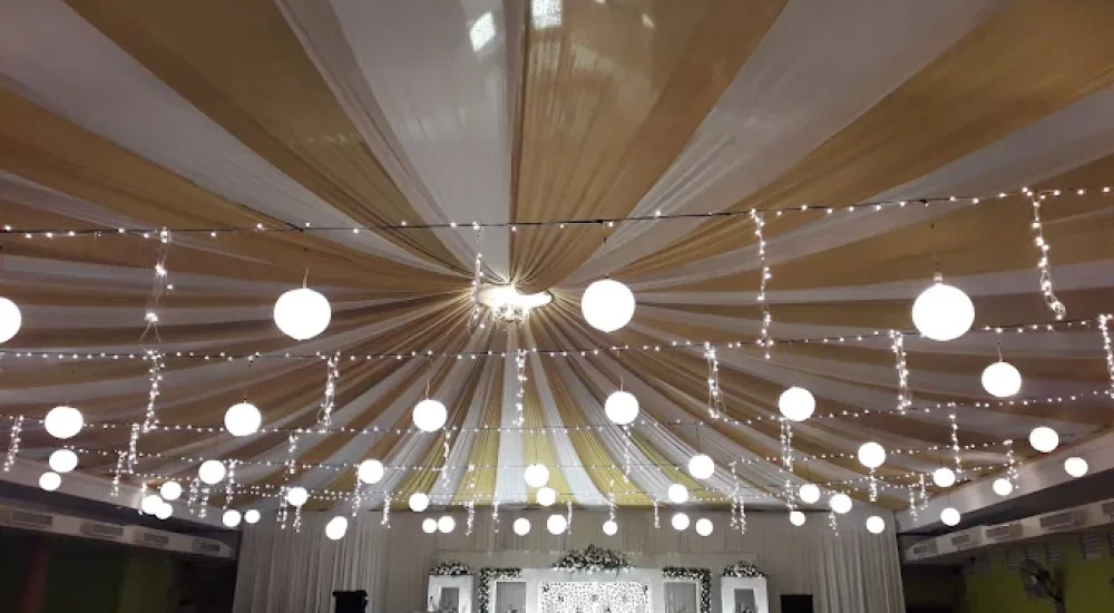 DD Retreat in Ernakulam is a spacious and well-equipped event venue ideal for grand celebrations, including weddings, receptions, and corporate functions. With a total guest capacity of up to 1,000, the venue offers both indoor and outdoor spaces to suit diverse event preferences. The indoor hall, priced at ₹1,10,000, provides a comfortable and elegant setting, while the outdoor area, available at ₹70,000, is perfect for open-air functions under the sky. The property also features ample parking space for up to 400 vehicles, ensuring hassle-free convenience for guests.