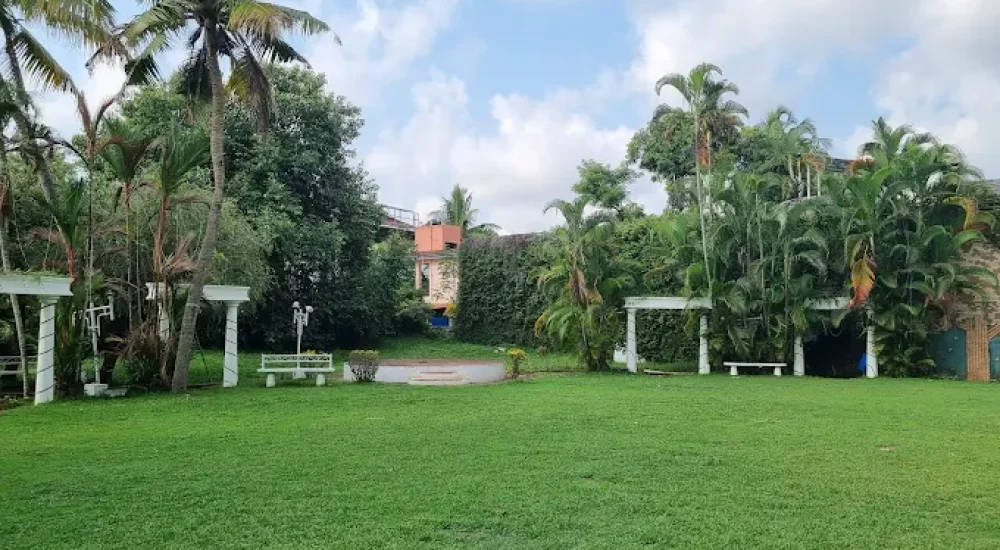 DD Retreat in Ernakulam is a spacious and well-equipped event venue ideal for grand celebrations, including weddings, receptions, and corporate functions. With a total guest capacity of up to 1,000, the venue offers both indoor and outdoor spaces to suit diverse event preferences. The indoor hall, priced at ₹1,10,000, provides a comfortable and elegant setting, while the outdoor area, available at ₹70,000, is perfect for open-air functions under the sky. The property also features ample parking space for up to 400 vehicles, ensuring hassle-free convenience for guests.