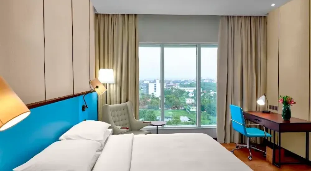 Spacious luxury suite at Hyatt Regency Thrissur featuring elegant interior design and premium furnishings for a comfortable stay.