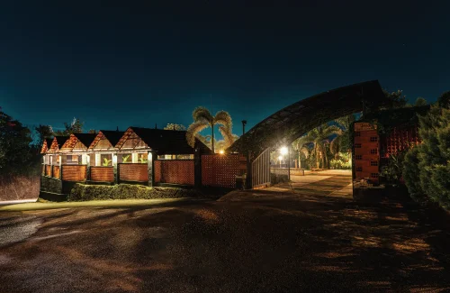 Wide entrance driveway and tropical landscaping design at K-Hills Resort and Spa premium event venue.