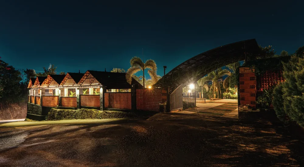 Wide entrance driveway and tropical landscaping design at K-Hills Resort and Spa premium event venue.
