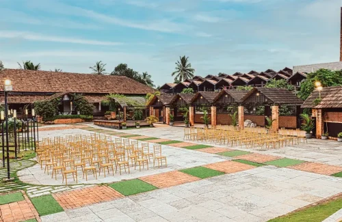 Premium open-air destination wedding stage setup on the Tera garden lawn at K-Hills Resort Kerala.