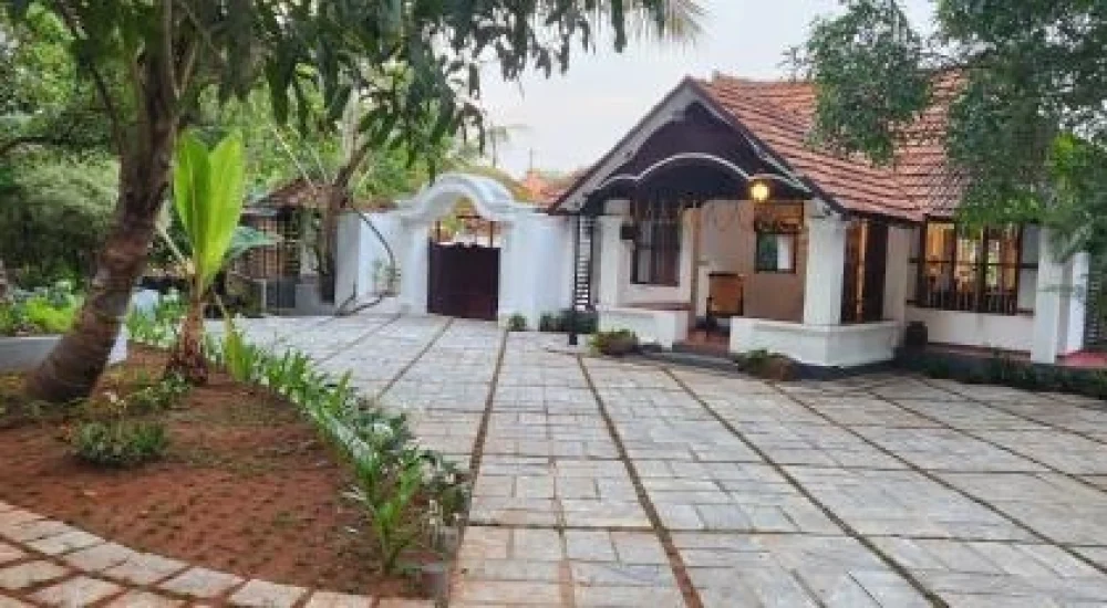 Kumarakom Tharavadu entrance featuring traditional Kerala architecture and terracotta courtyard