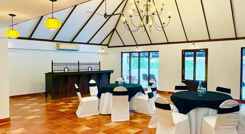 AC indoor function hall and dining setup for small events at Kumarakom Tharavadu heritage venue