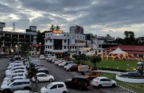 Spacious on-site car parking facility at Hotel Merlin International Thrissur for wedding guest vehicles