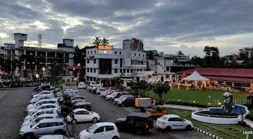 Spacious on-site car parking facility at Hotel Merlin International Thrissur for wedding guest vehicles