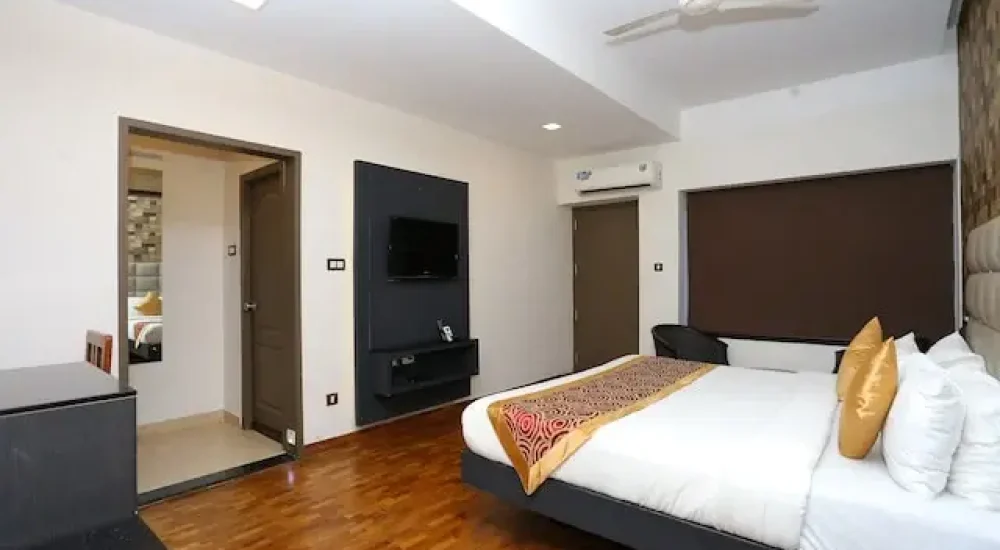 Air-conditioned family suite room interior at Hotel Merlin International Poothole Thrissur