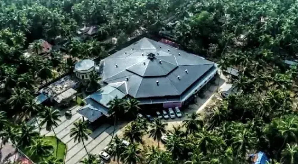 Aerial helicam view of Namas International Convention Centre, showcasing the sprawling single-floor building layout and extensive 30,000 sq. ft. structure in Thrissur.