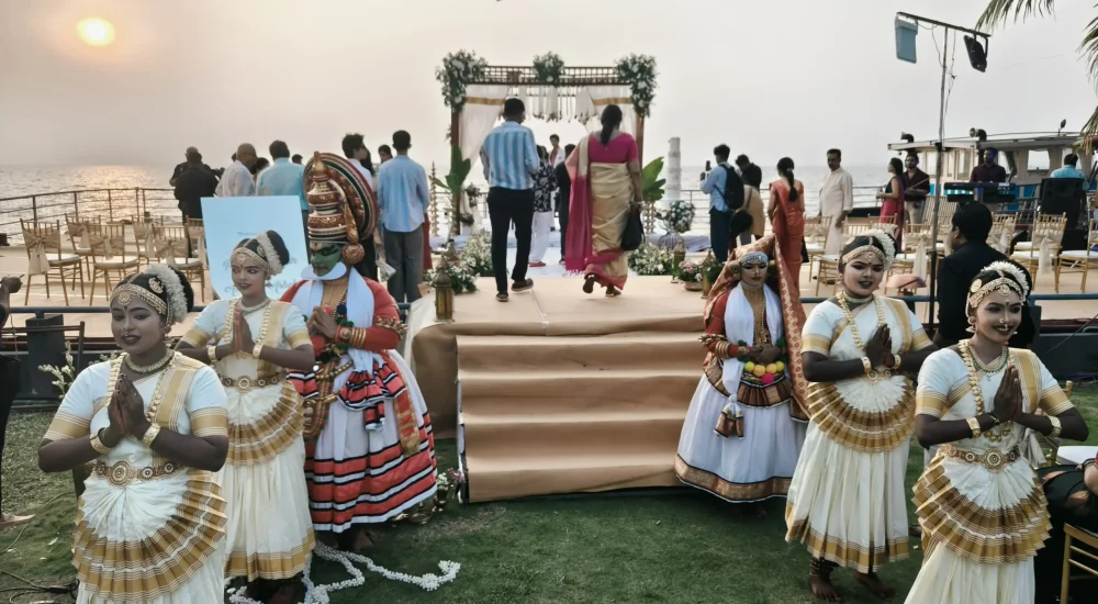 Destination wedding floating boat stage mandap on Vembanad lake with Kathakali and Mohiniyattam artists at Rhythm Kumarakom